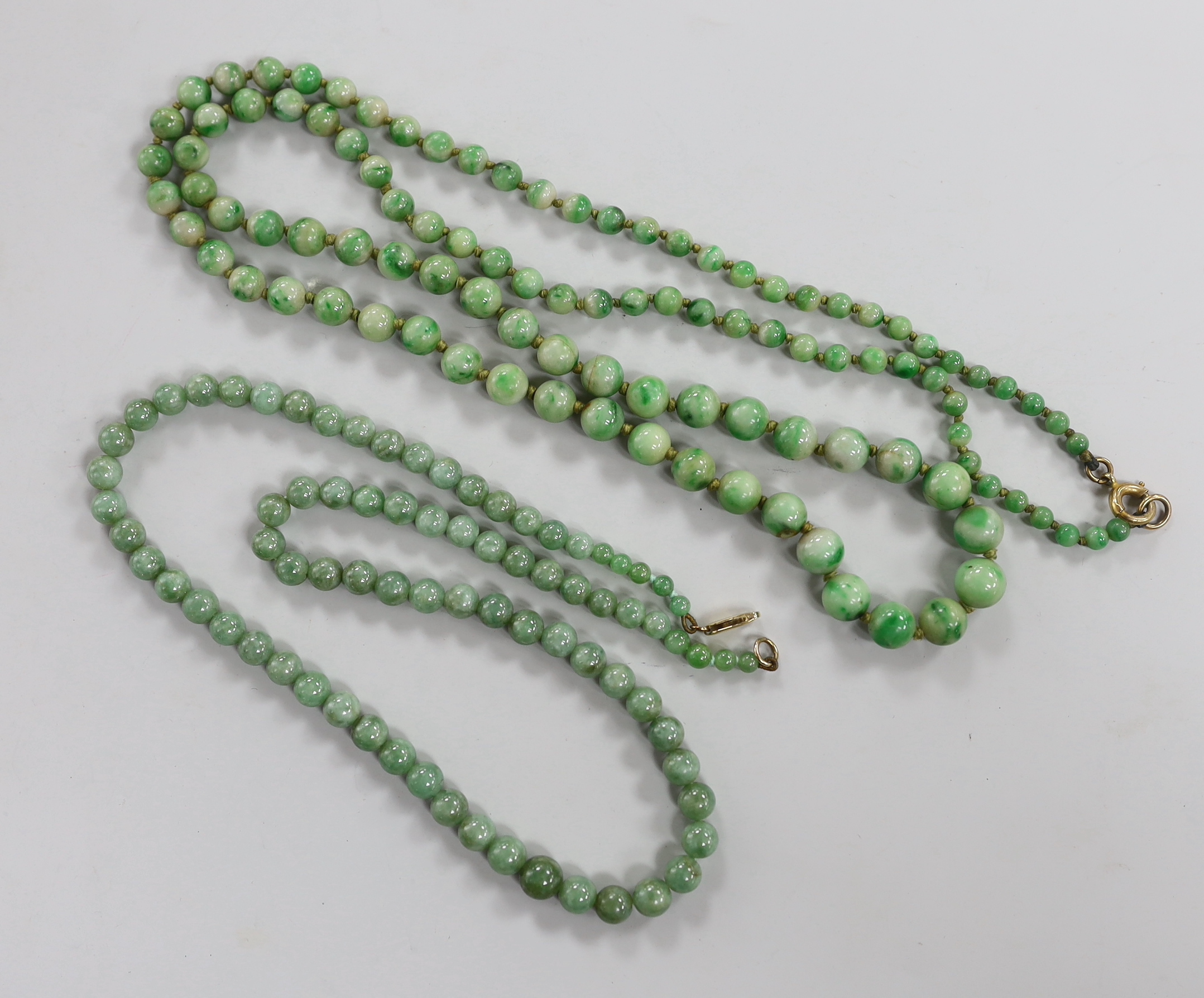 Two single strand graduated jade bead necklaces, 52cm & 84cm.